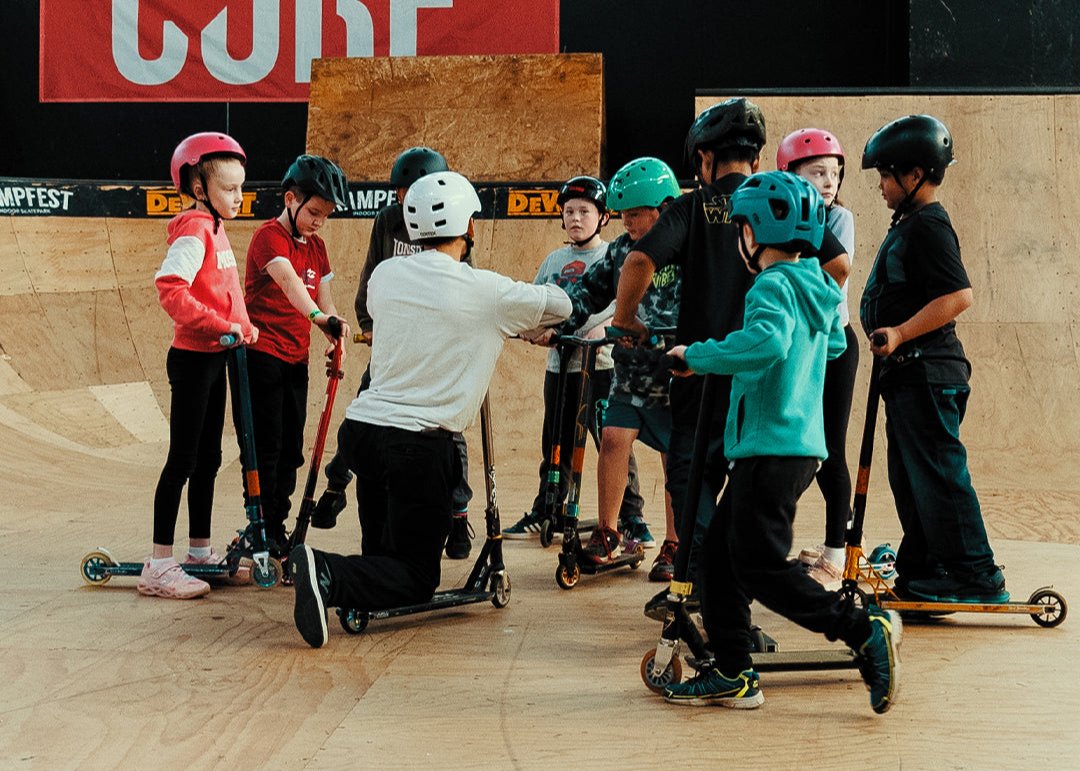 Group of School Kids with a RampFest Coach while visiting for a Group Scooter Excursion.