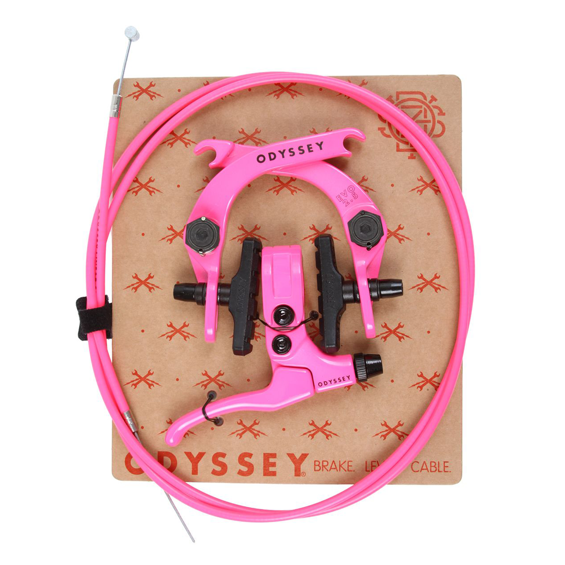 A bright pink Odyssey brake lever and matching brake cable, displayed on top of a branded brown cardboard backing against a white background.
